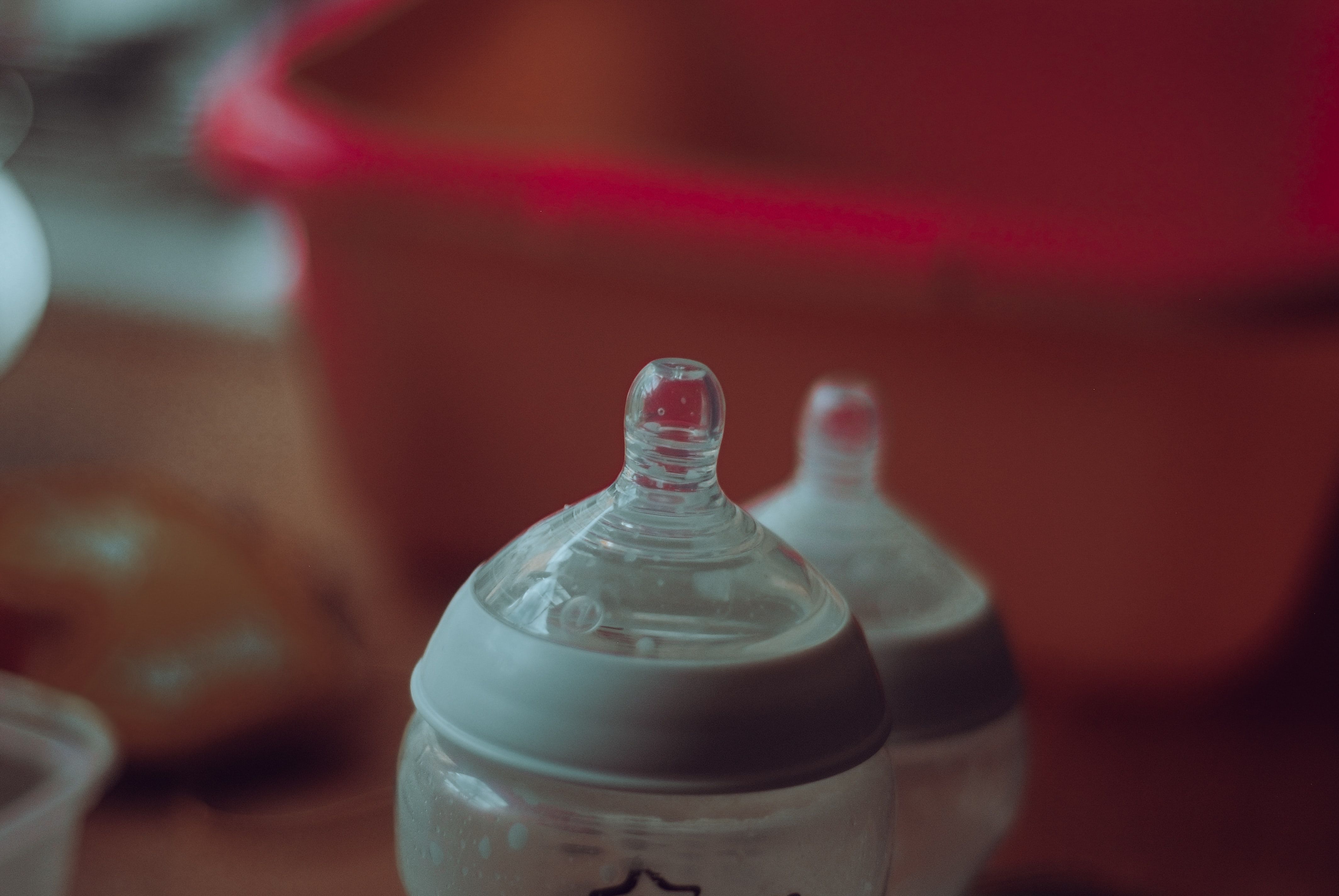 Photo by Jaye Haych on Unsplash - Baby bottle, baby essentials, organise your home for a new baby.jpg