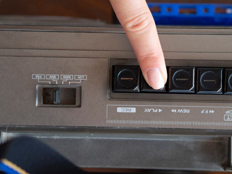 close-up-shot-person-pushing-music-player-s-play-button_23-2148289130.jpg