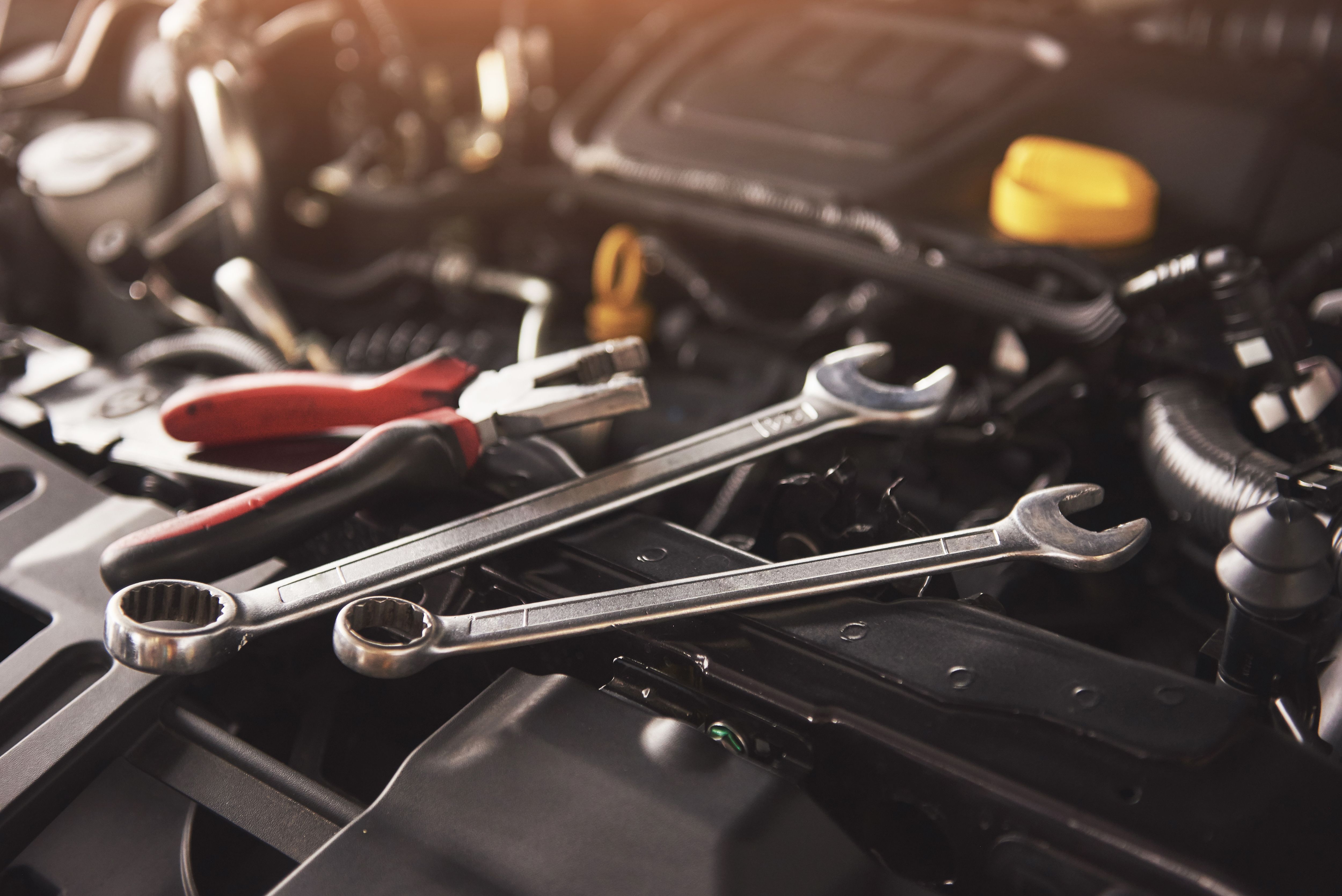 mechanic-hand-checking-fixing-broken-car-car-service-garage (2).jpg